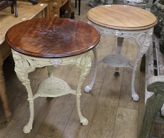 A pair of Victorian mahogany topped cast iron pub tables W.61cm and W.65cm.